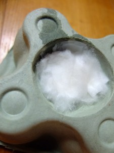 Damp cotton wool pushed into the hole.