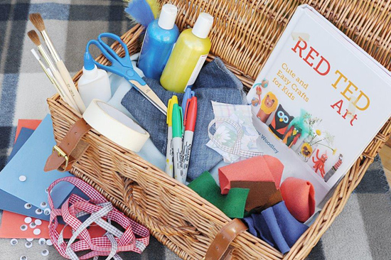 A hamper of crafting supplies with the Red Ted Art craft book.