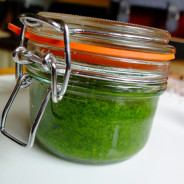 A jar of bright green nasturtium pesto
