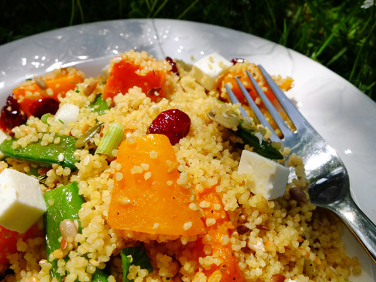 Couscous salad with feta, butternut squash, sugar snap peas and dried cranberries.