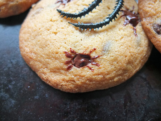 Chocolate chip cookies with the melted chips shaped into spiders.