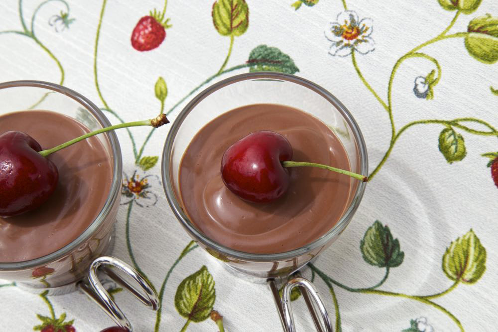 Vegan chocolate mousse with a cherry.