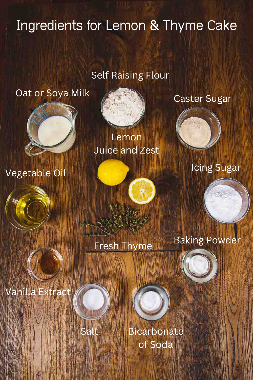 The ingredients for Lemon and Thyme Cake are laid out on a table and labelled.