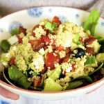 Greek Salad Couscous served in a patterned bowl.