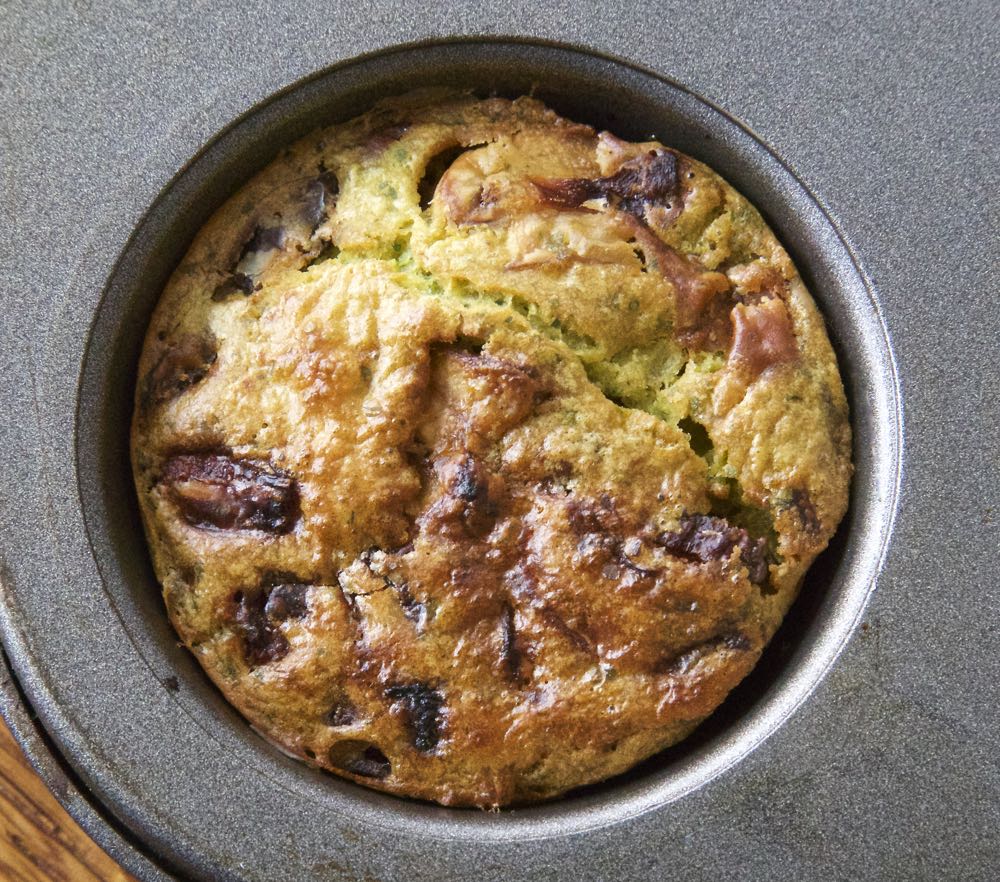A vegan breakfast muffin in a muffin tin.