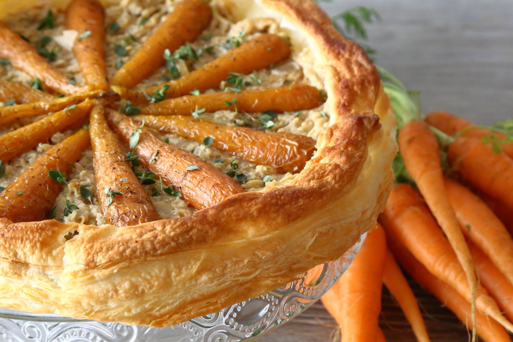 Roast carrot and hummus tart with a puff pastry crust.