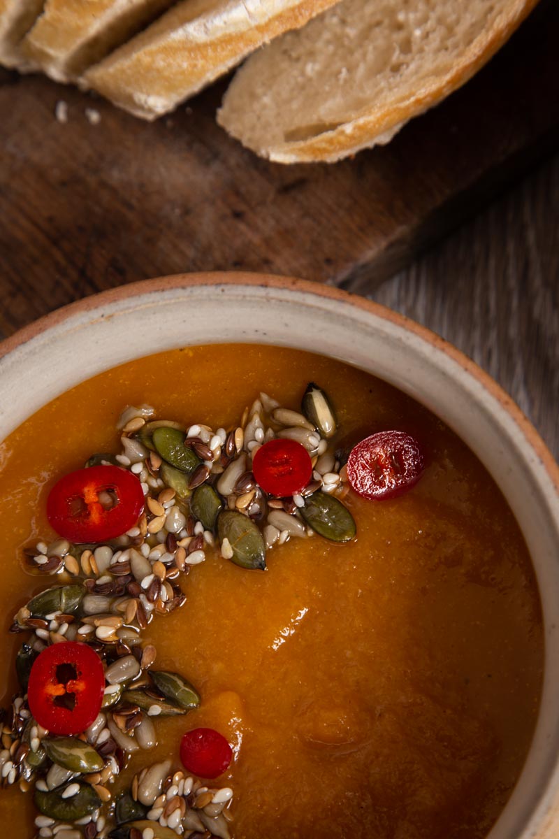 Root Vegetable Soup Topped with Mixed Seeds and Chilli.