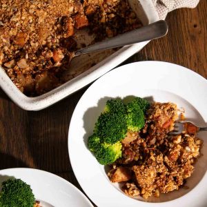 Lentil Bake in a bowl with steamed broccoli.