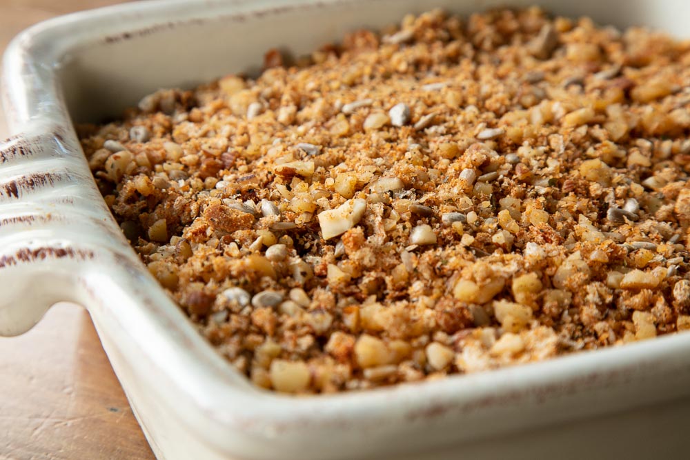 Nut crumble topping in a casserole dish.